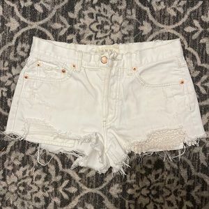 We the Free. White distressed denim high rise jean shorts.